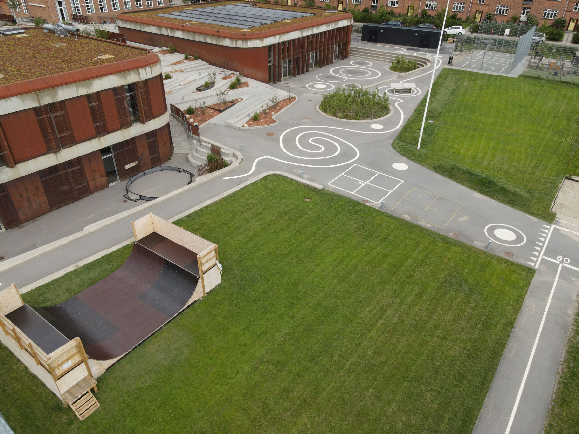 Close-up of dense green artificial grass blades forming an even, textured surface filling the entire frame