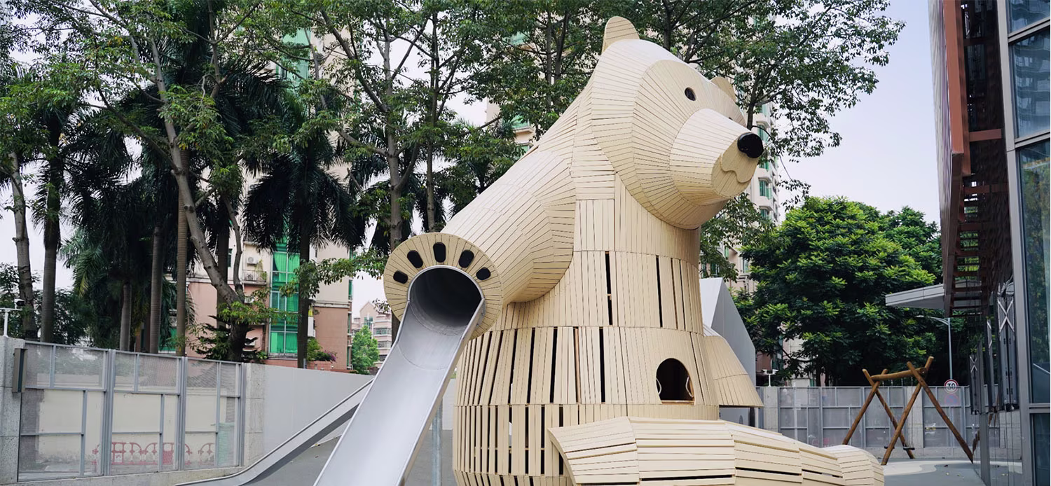 wooden playground sculpture looking like a big bear in kindergarten in China