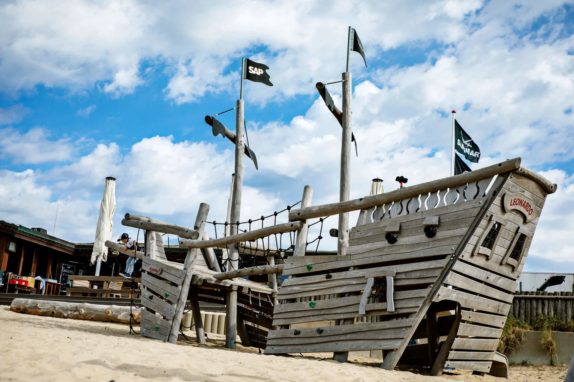 Wooden pirate playground ship on the beach at Sansibar Restaurant