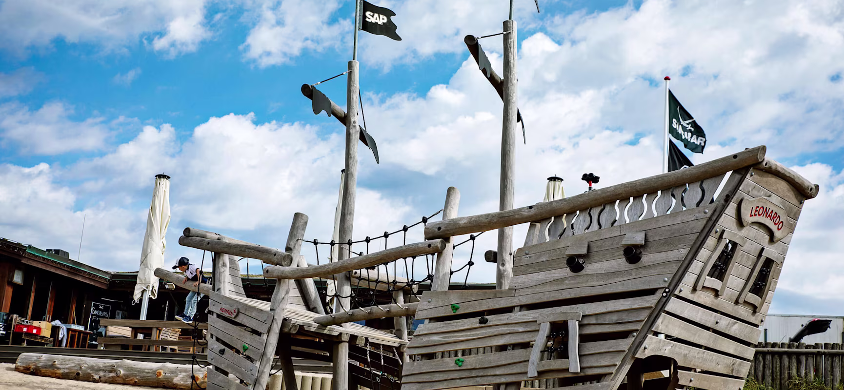 Wooden pirate playground ship on the beach at Sansibar Restaurant