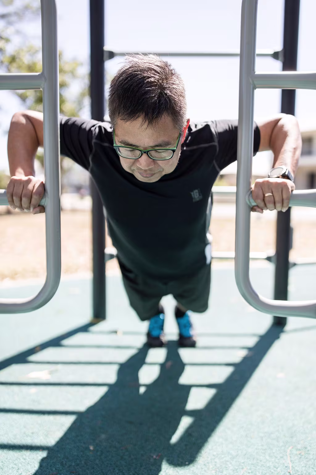 outdoor callisthenics gym in front of a building