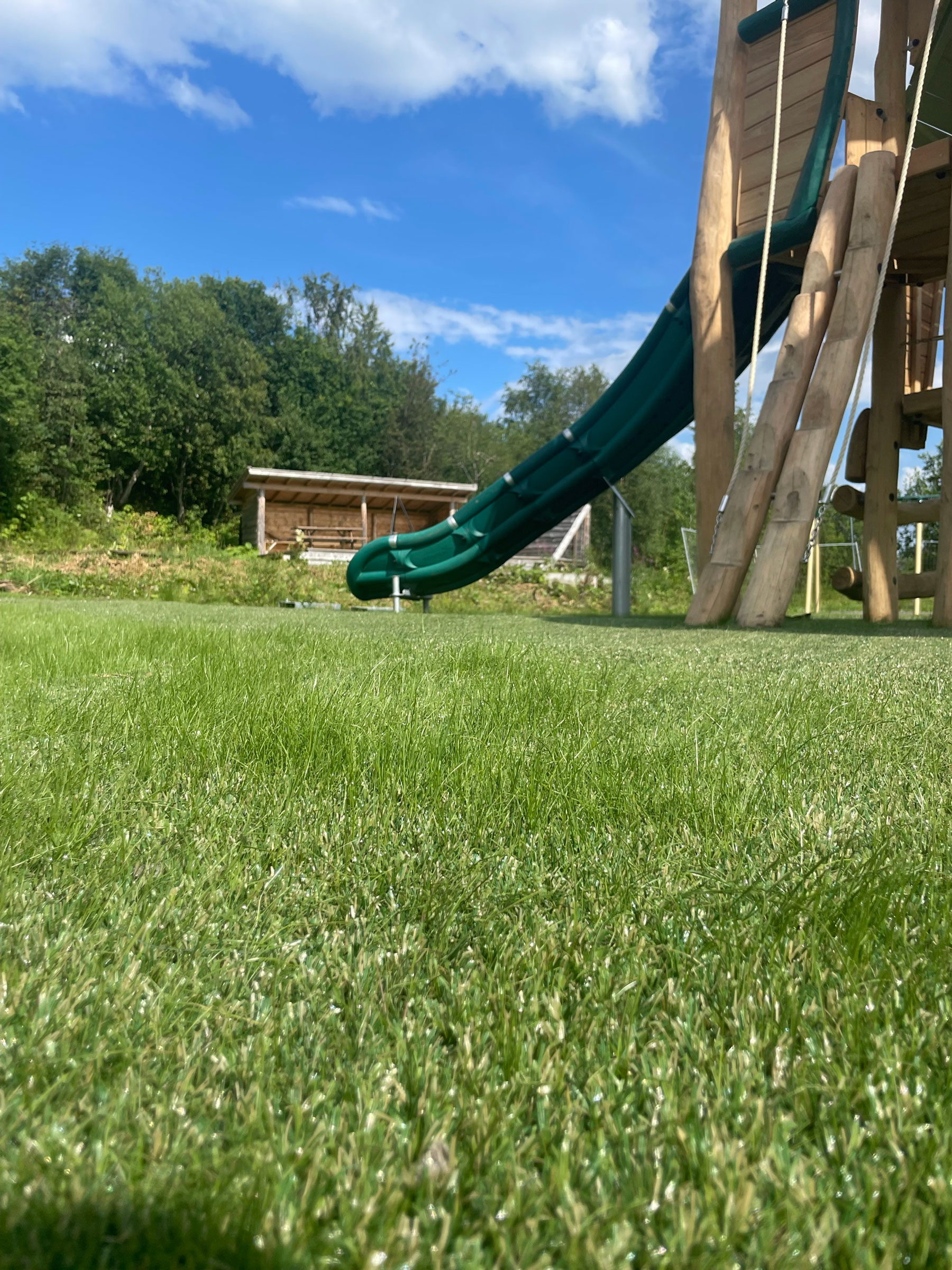 coloured artificial grass on a circus themed playground