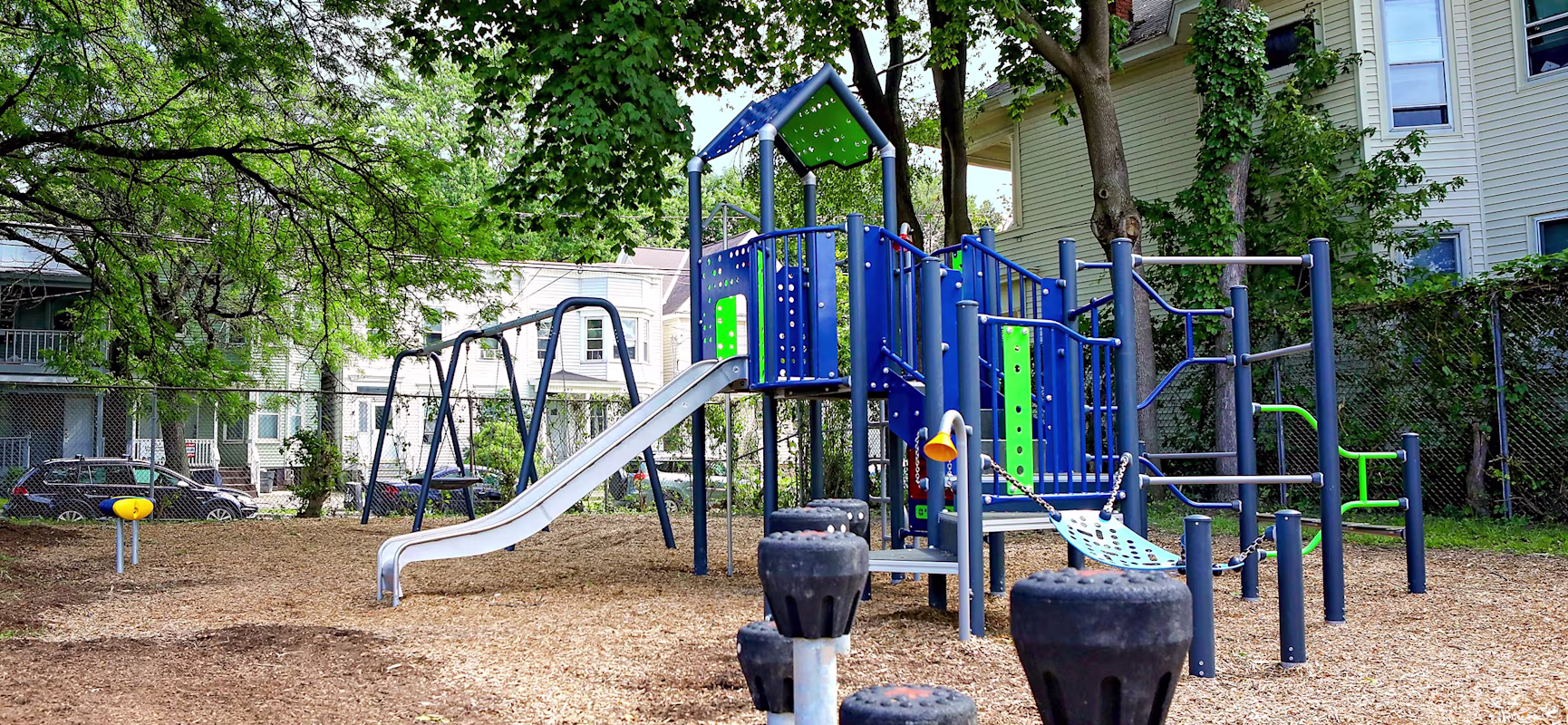 Children having fun sliding and climbing on a MOMENT play system
