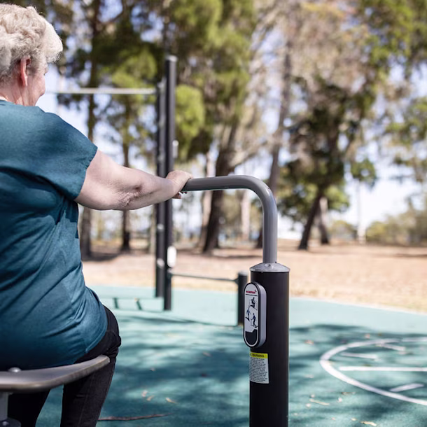 senior citizens using outdoor gym equipment for elderly hero image