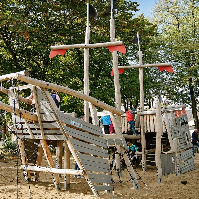 Kids playing on rope playground equipment