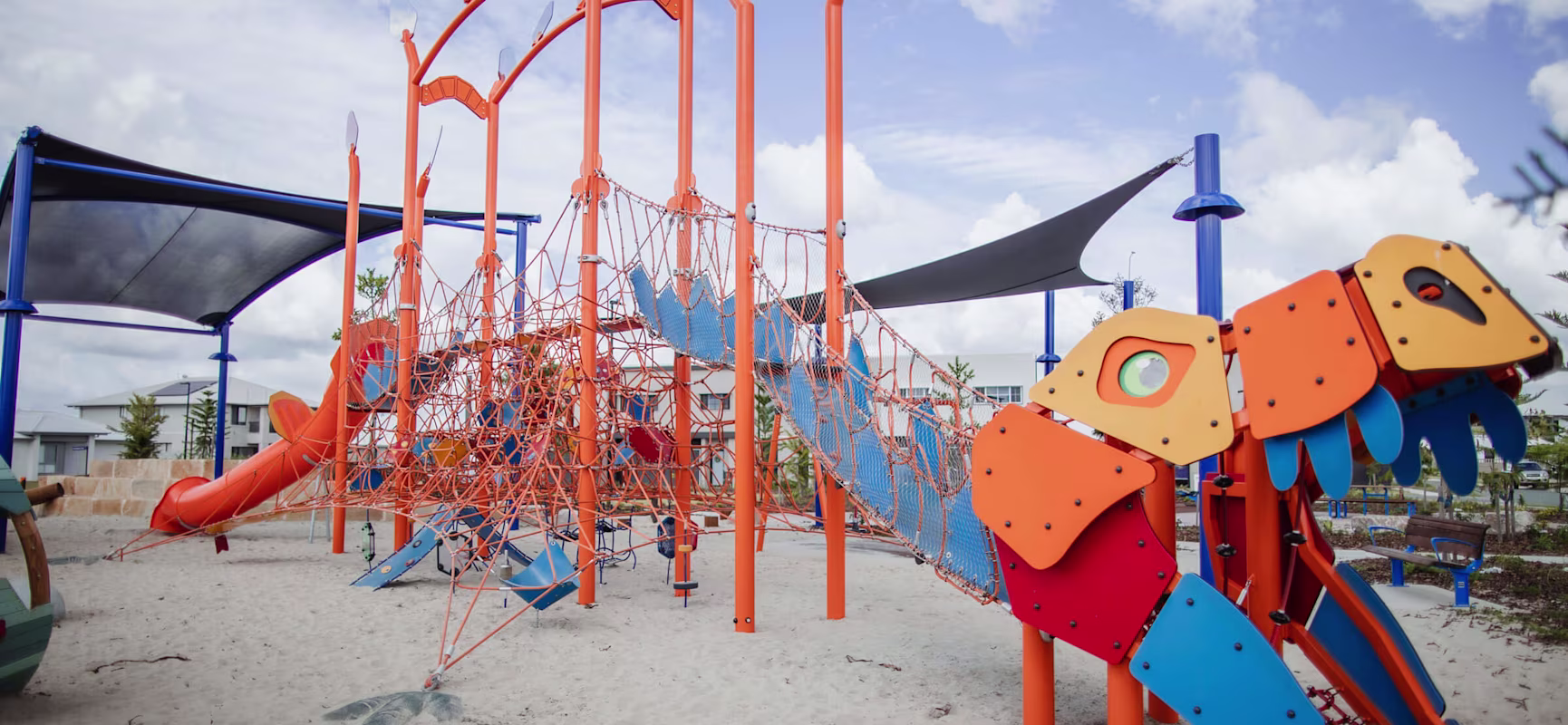 Custom rope playground in Australia picturing an orange and blue dinosaur