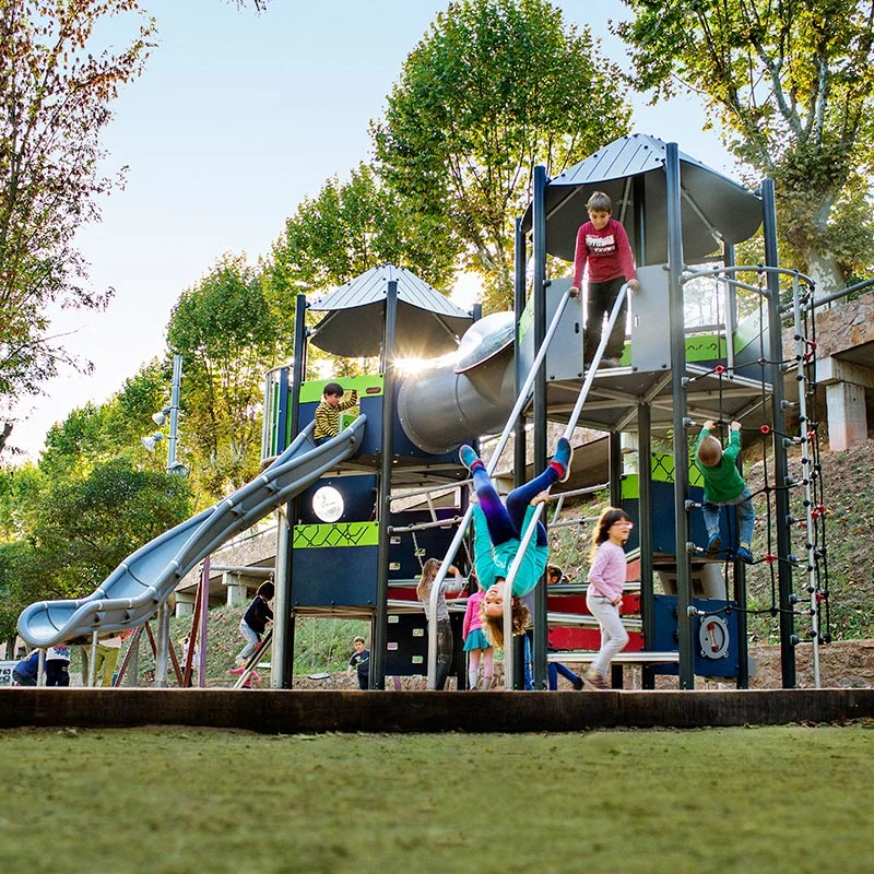 children in a park playing on MOMENTS play system for school-agers
