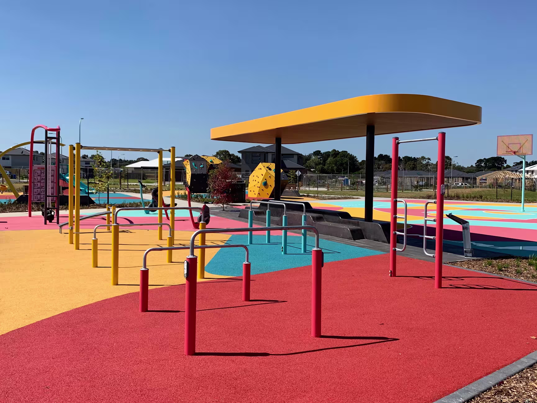 woman working out on outdoor calisthenics equipment