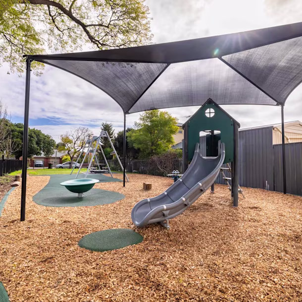 playground shade structure on a climbing playground structure