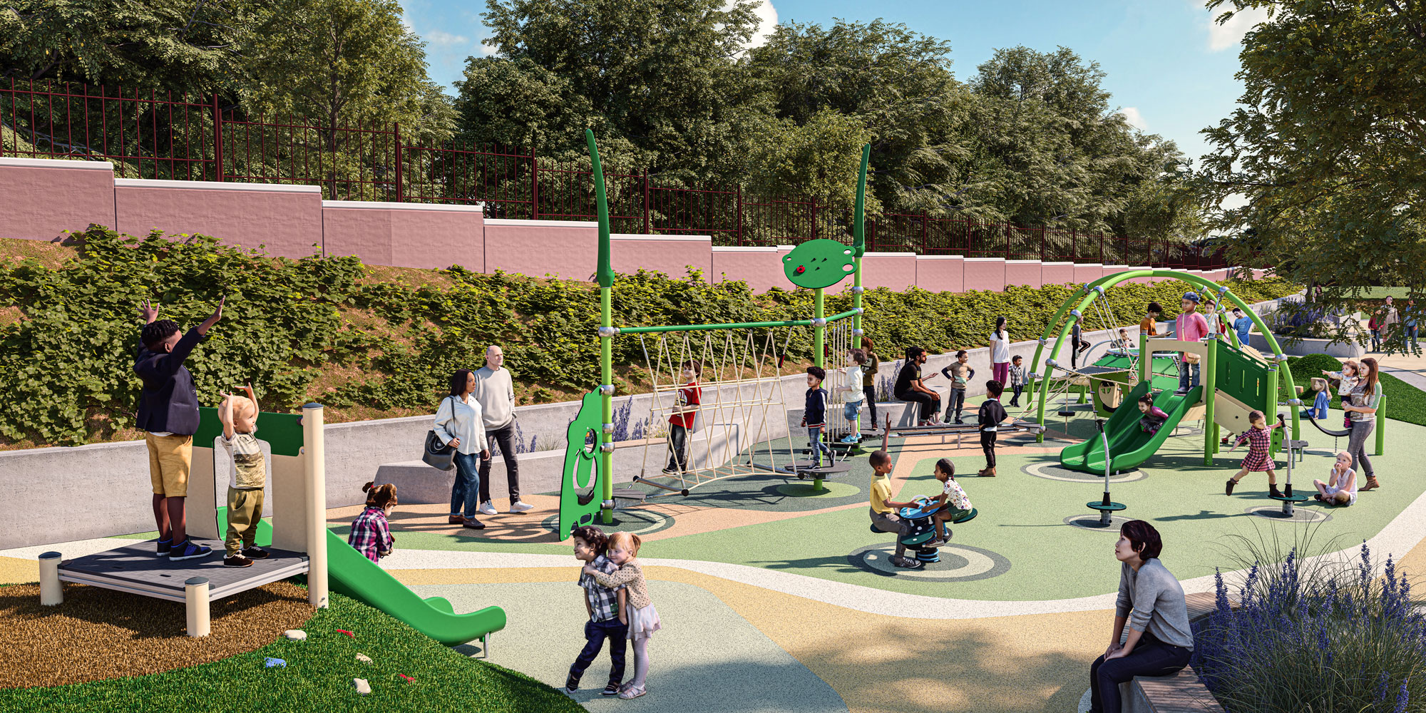 Children and adults play on a busy green playground with slides, climbers and swings, surrounded by trees and a pink wall.