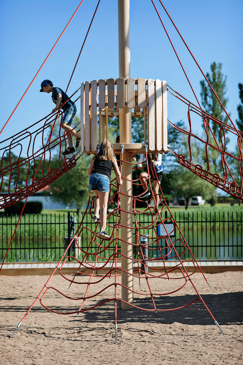 Kids on rope and wood playground