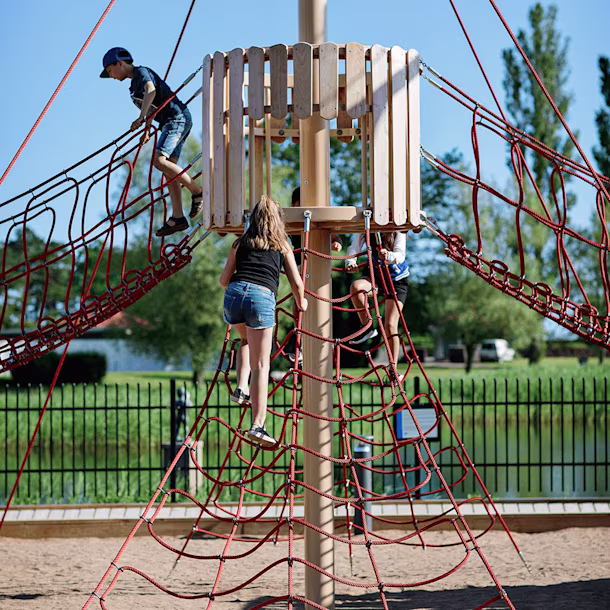 Kids on rope and wood playground