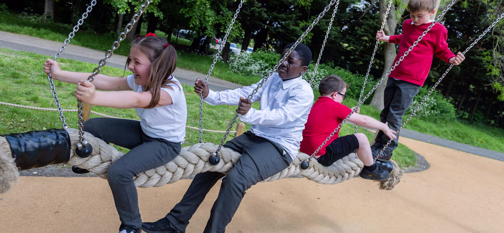 children playing on special education needs playground equipment