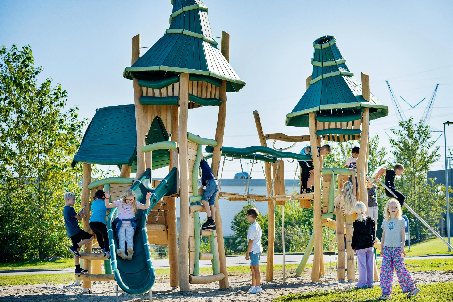 wooden fantasy themed play structures with children