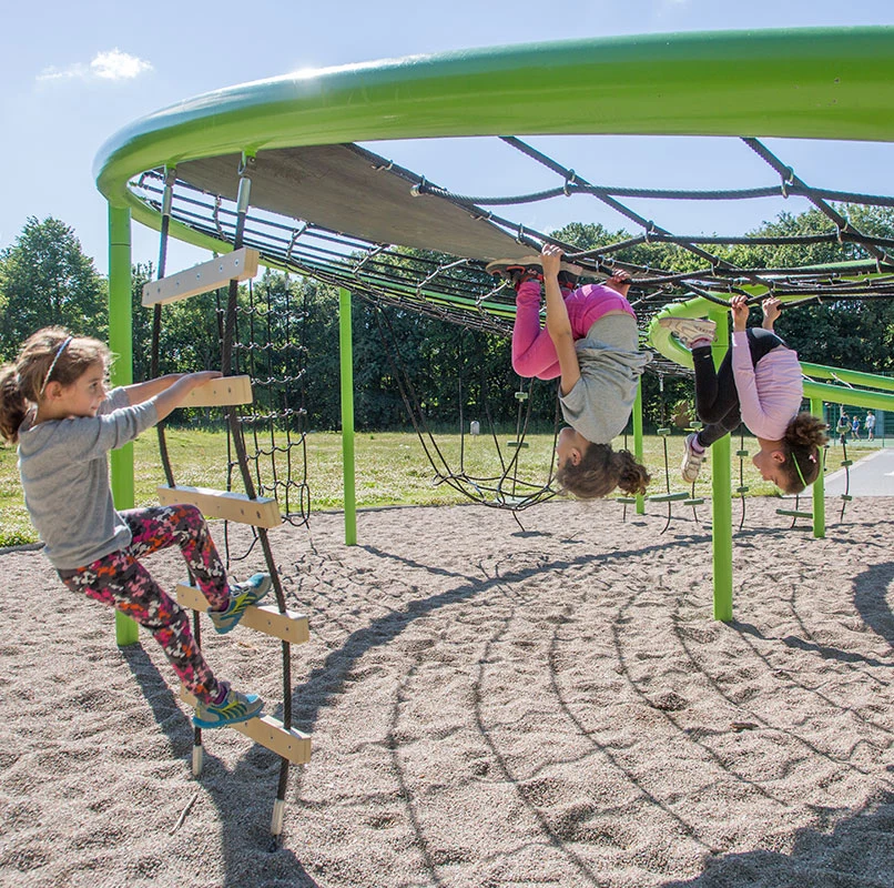 children playing on a green corocord loops playground reference