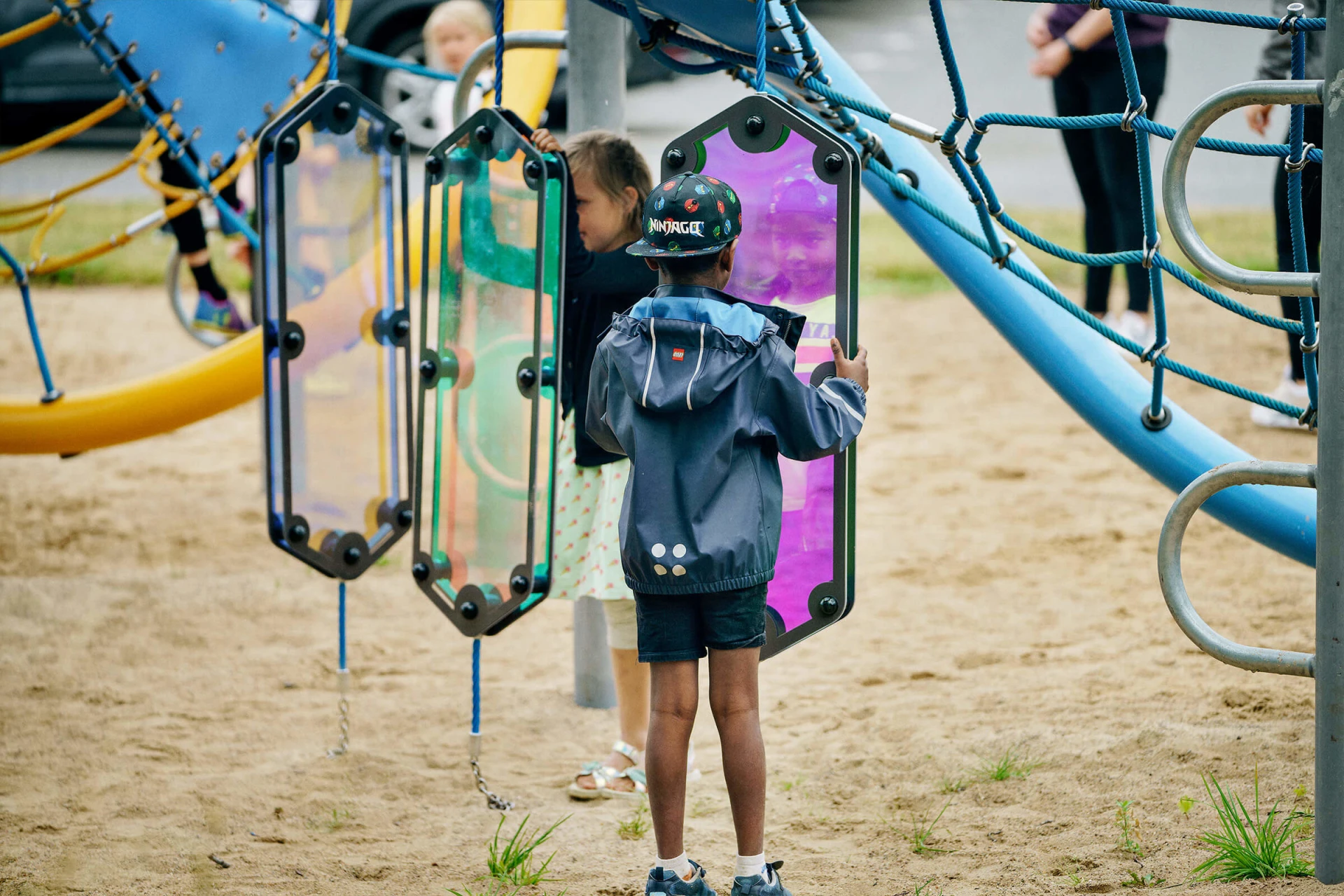 Intrigued children participating in sensory play on a playground