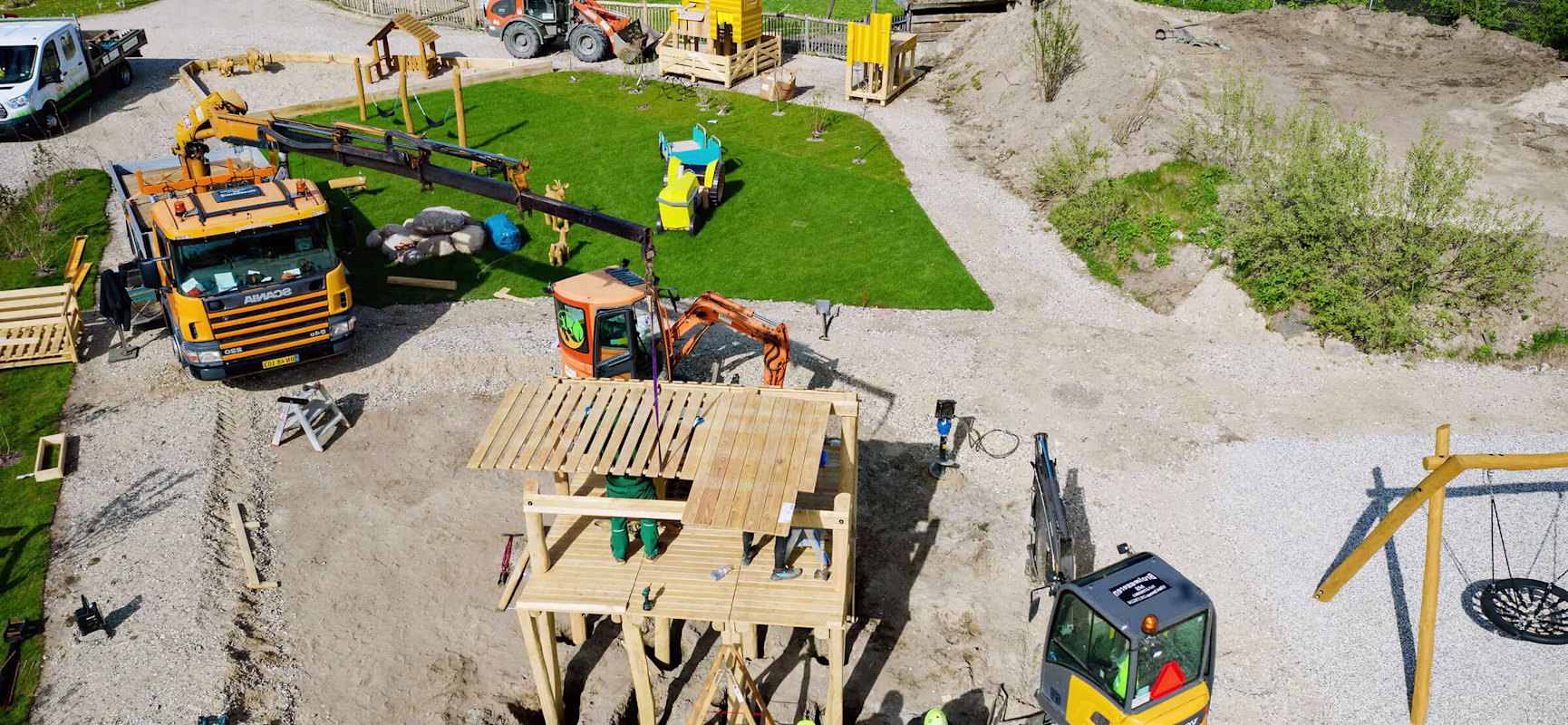 Installation site with workers and a large crane