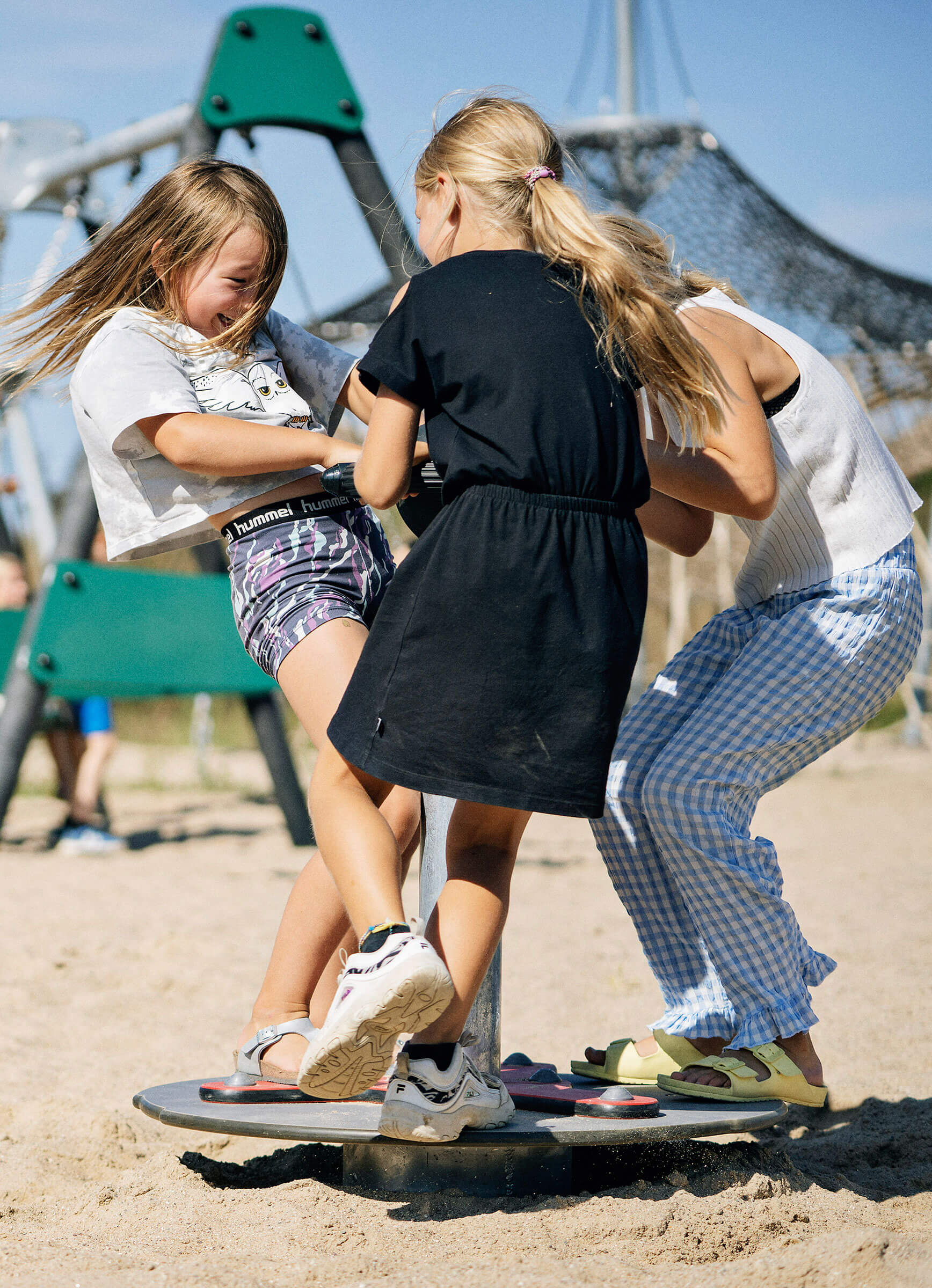 The scooter carousel has a roomy platform, here three girls play at a time
