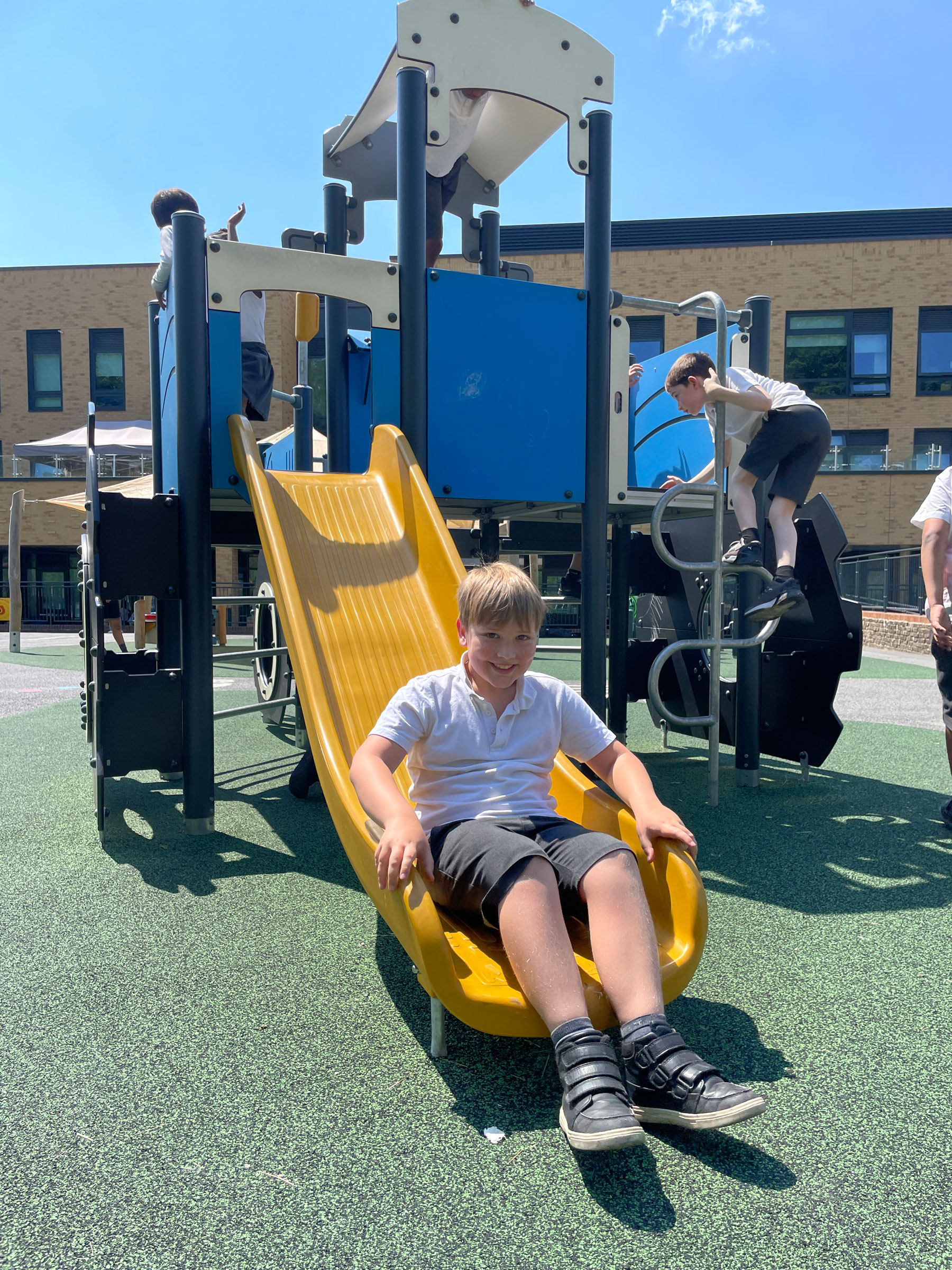 children playing on musical playground equipment at a playground in France