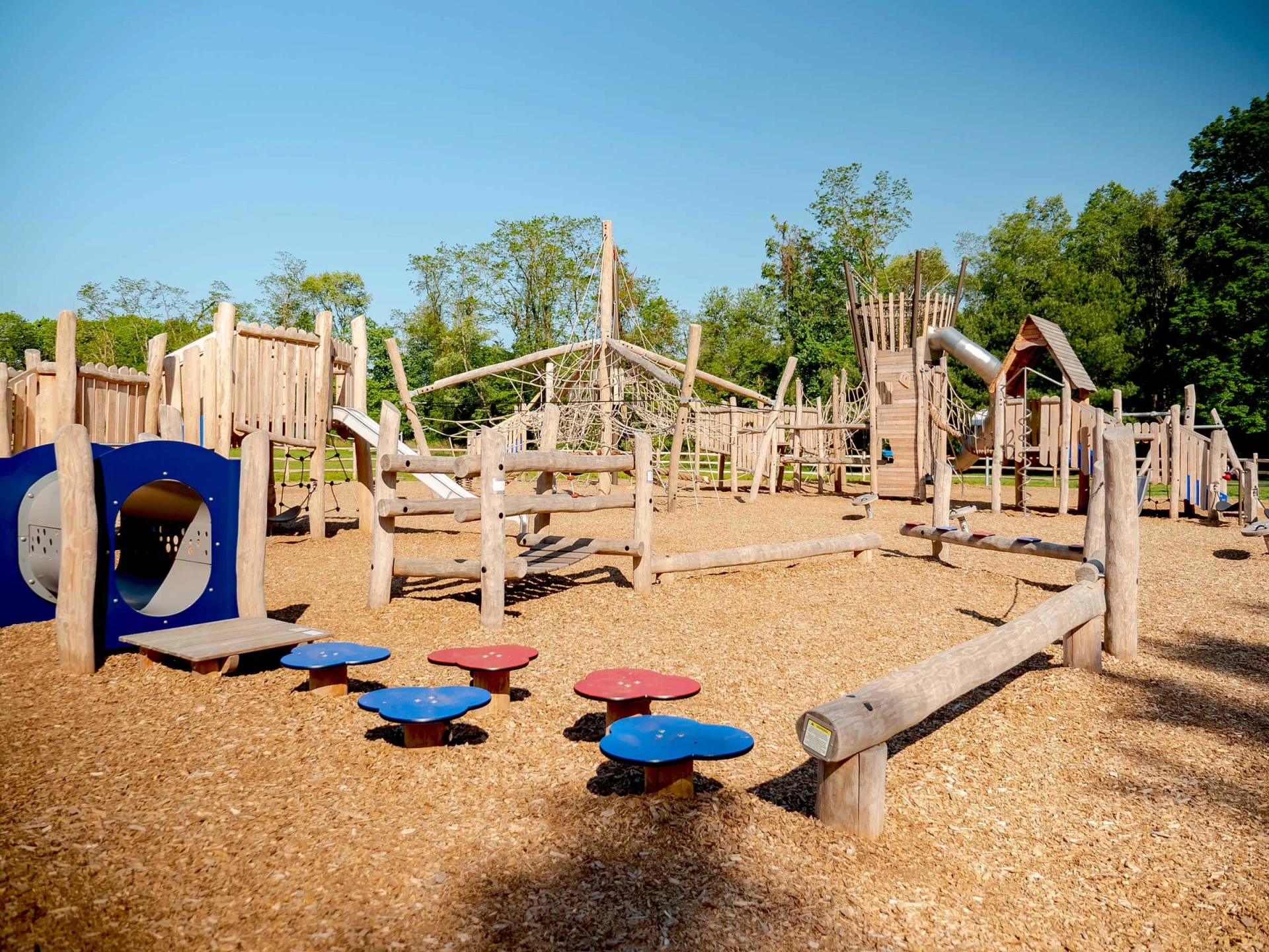 Wooden playground with balancing and climbing playground equipment in a shool