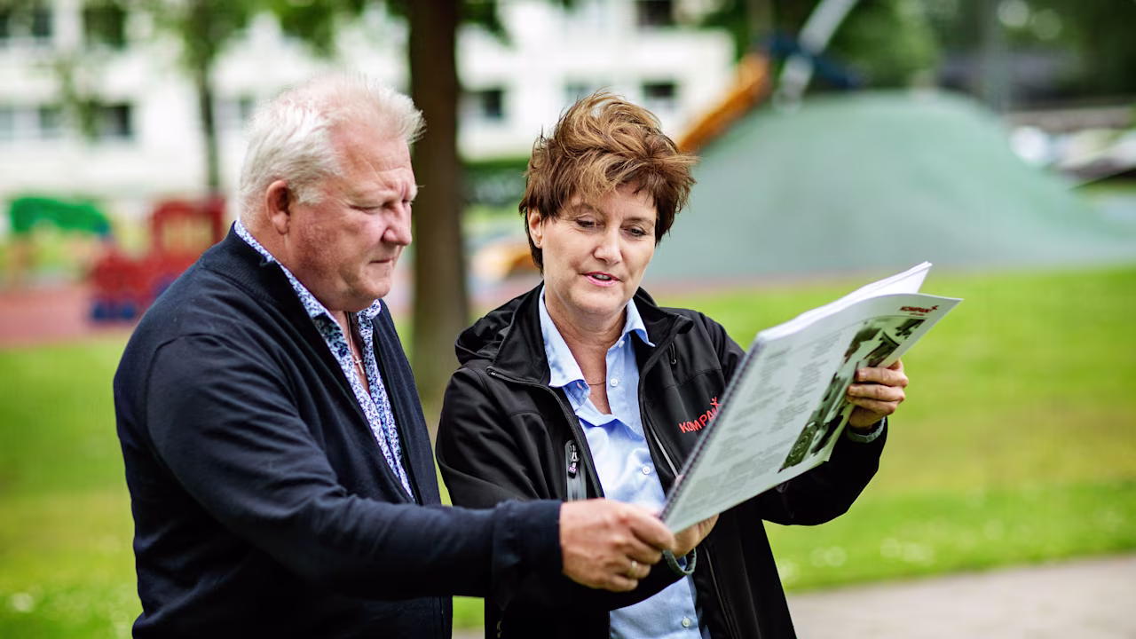 people planning a playground reviewing a playground site