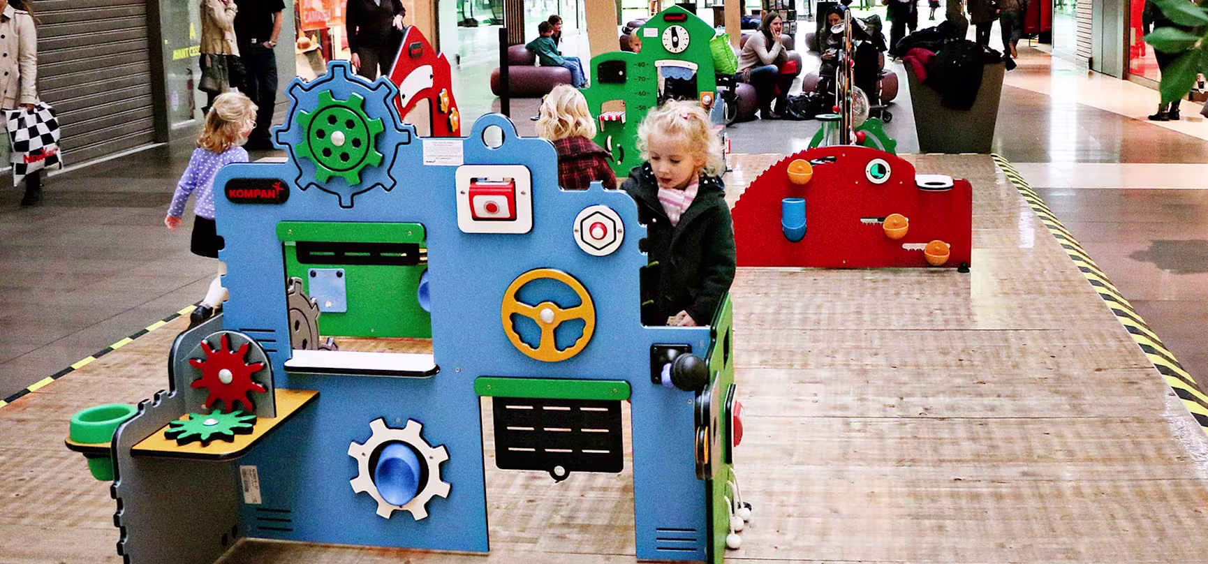 children playing indoor at a mall on service and workshop toddler station