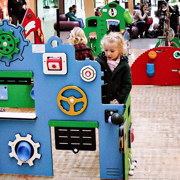 children playing indoor at a mall on service and workshop toddler station
