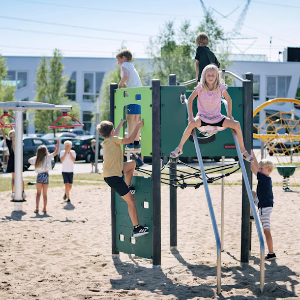 Children climbing on playground climbing structures at KOMPAN Denmark