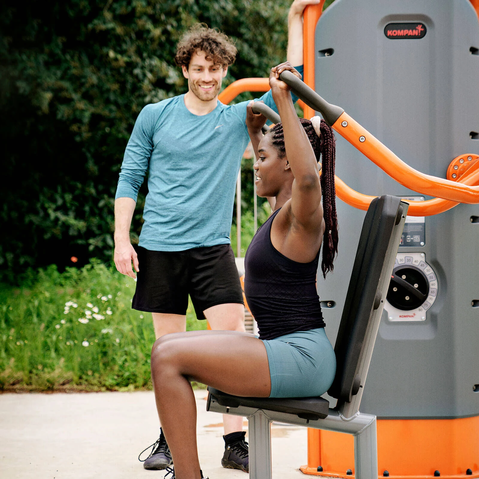 people using outdoor strength training gym equipment