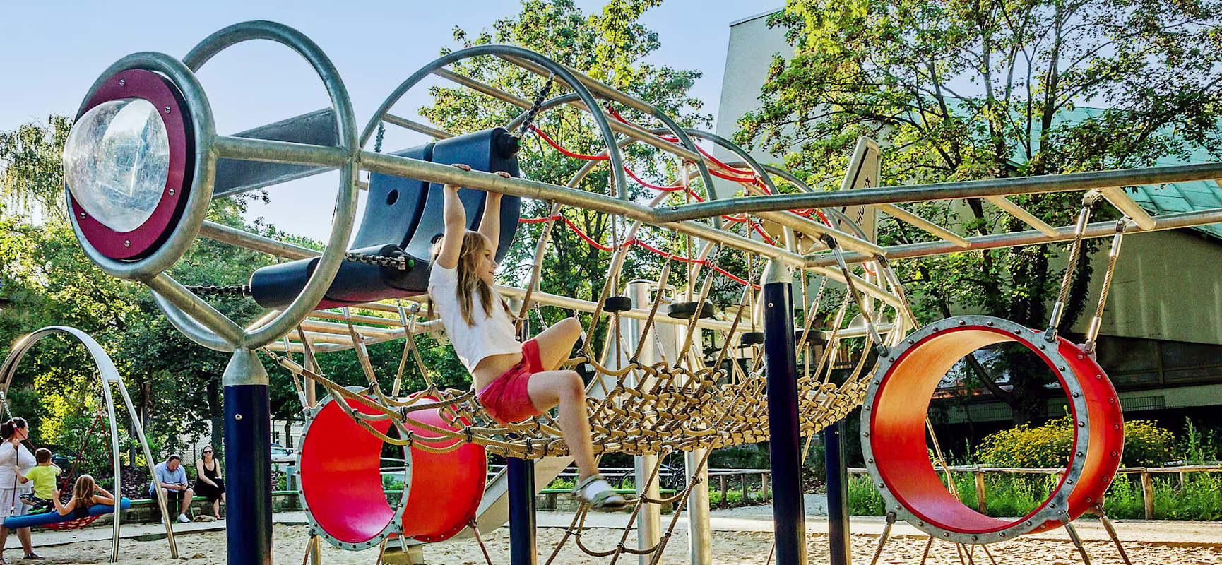 Girl climbing on a playground plane at Lietzensee in Berlin