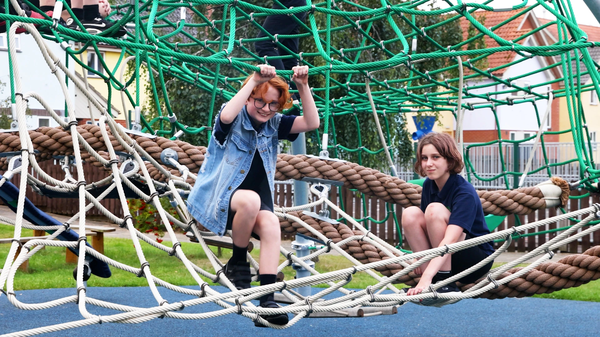 Children playing on playground climbing dome