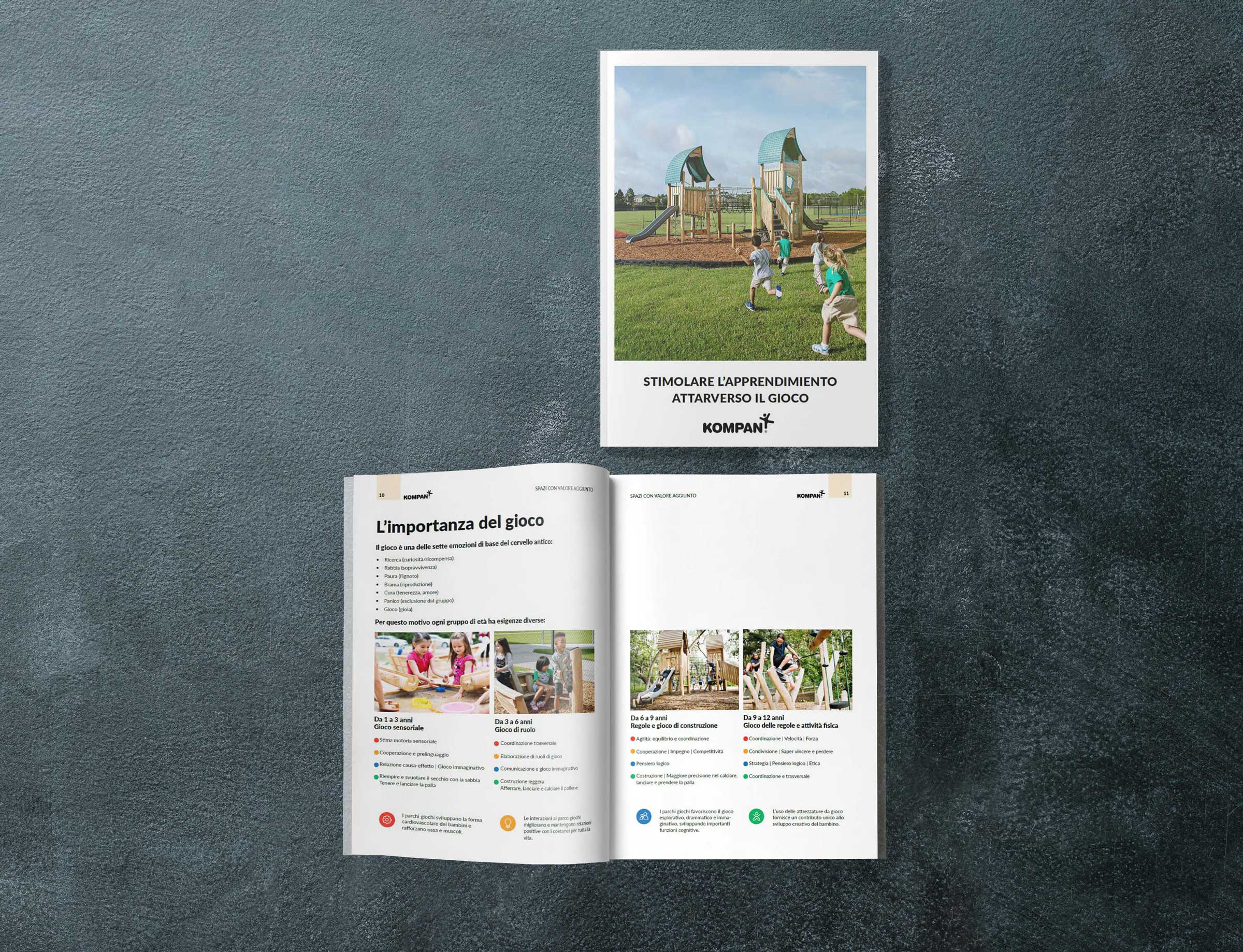 Two brochures on a dark surface, one closed showing kids playing on a playground, one open with Spanish text and photos of children.