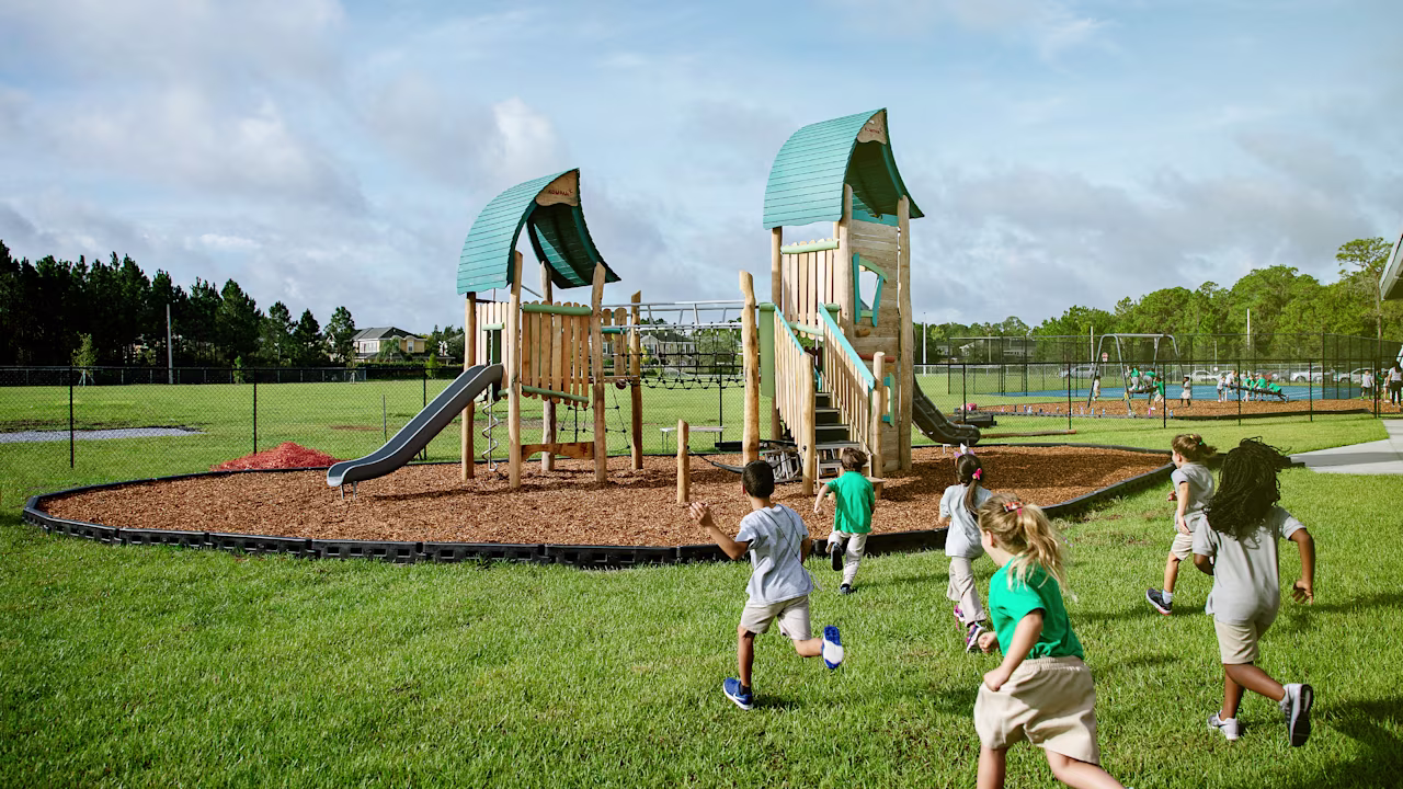 Students running towards the school playground during their break