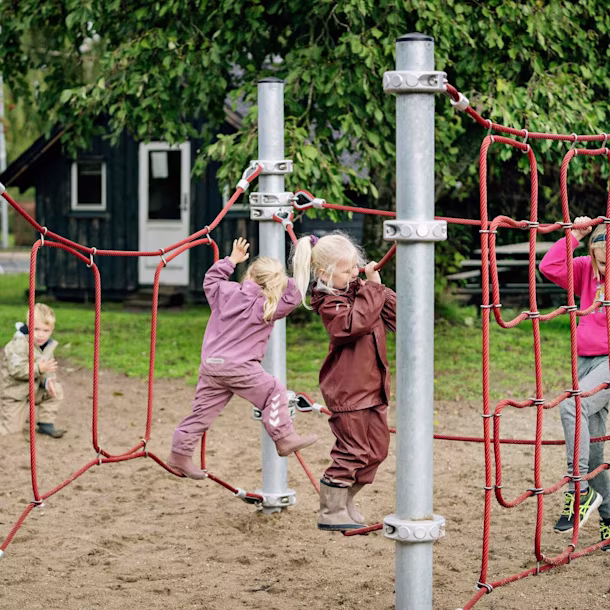 Girls playing in climbing trails for primary schools