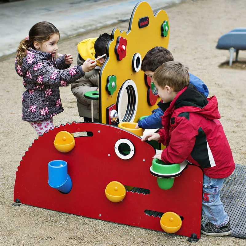 children playing in a kindergarten on a toddler station mimicking a greenhouse 