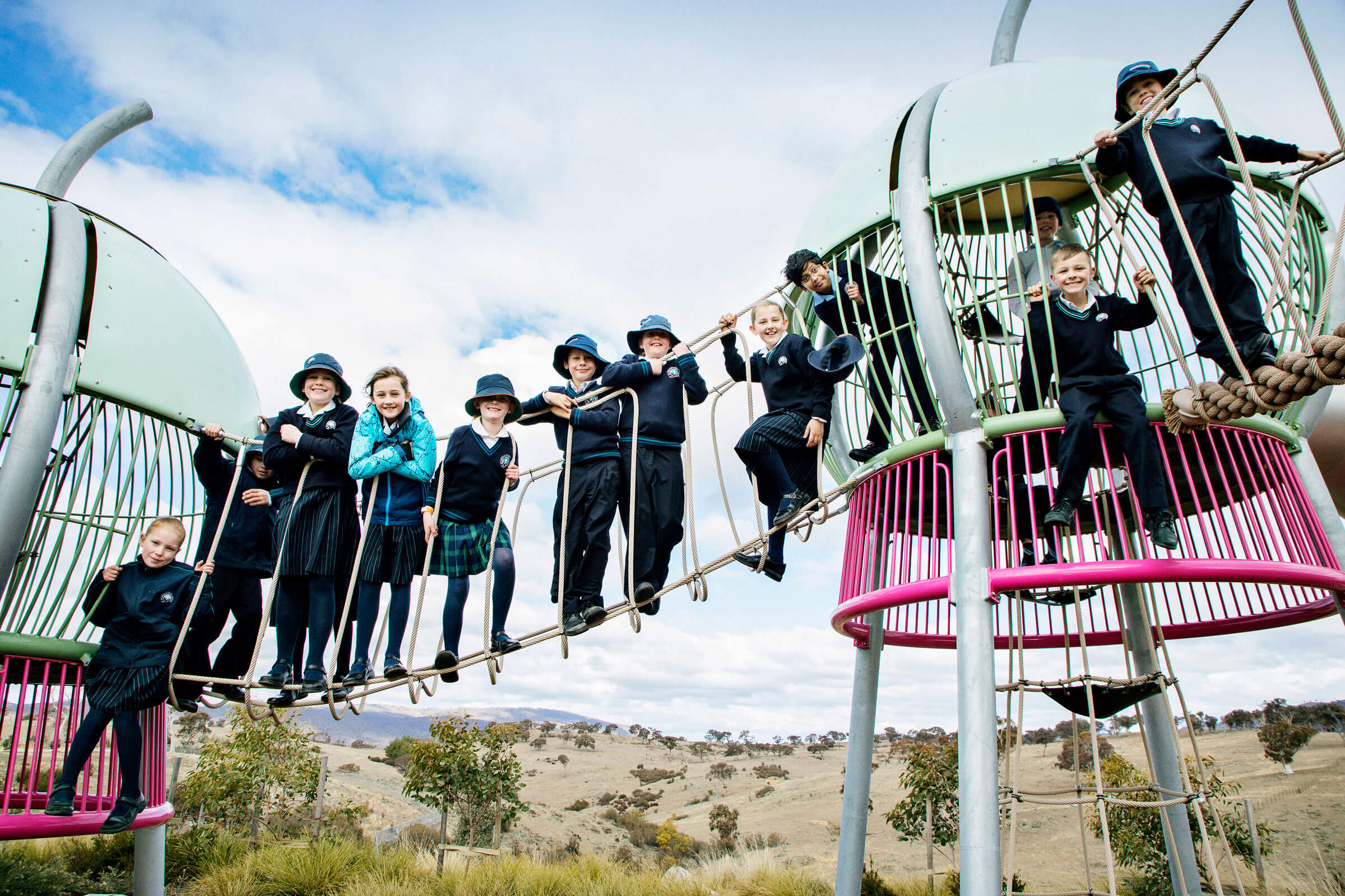 School children standing on a rope sky walk in Yerradhang Nguru Park playground