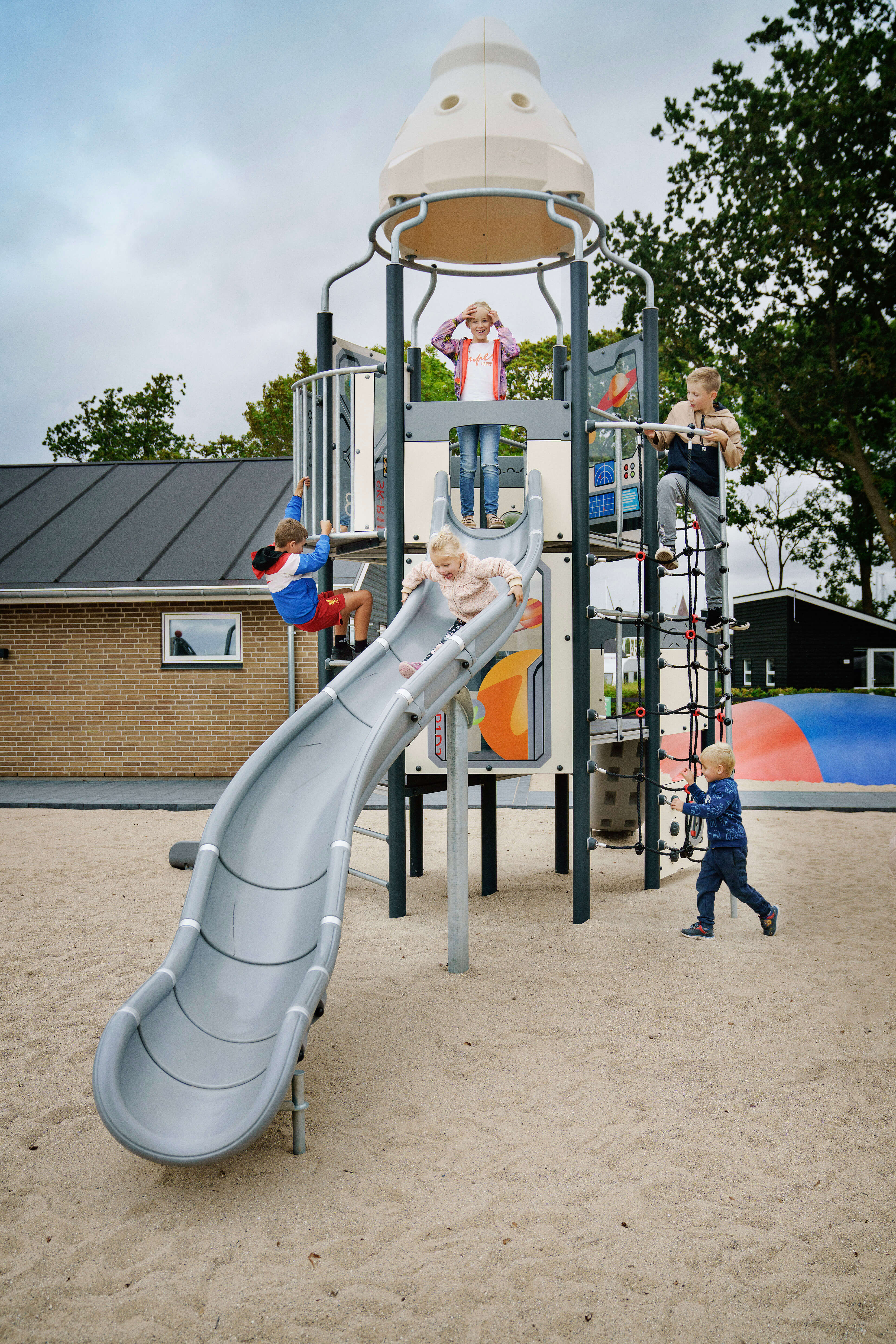 25- SIK7357 - Camp One Kids playing on Rocket Ship