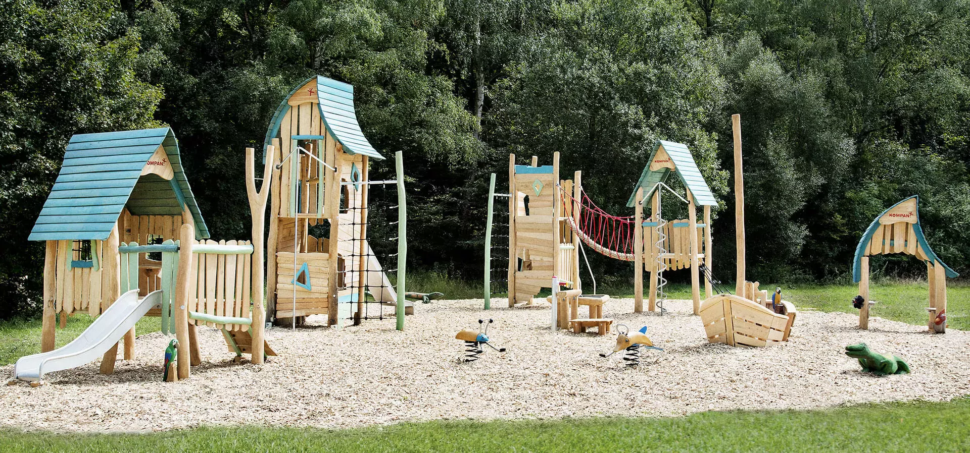wooden playground village with wooden houses hero image