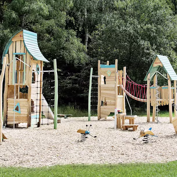 wooden playground village with wooden houses hero image