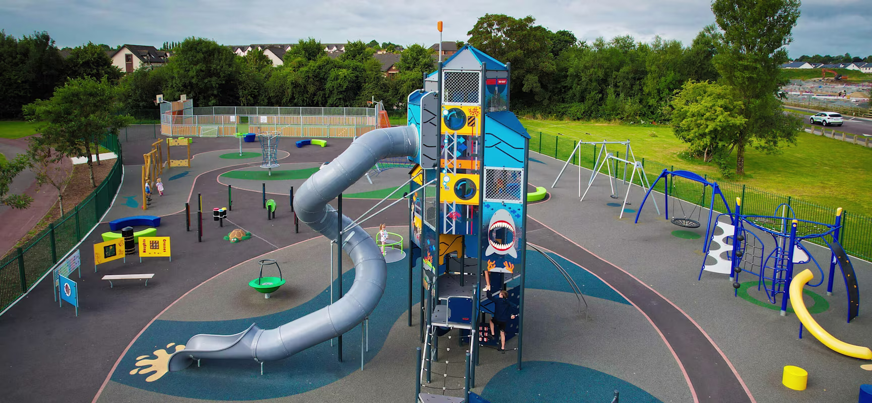 A children's playground with a GIANT playtower with 9 metre slide