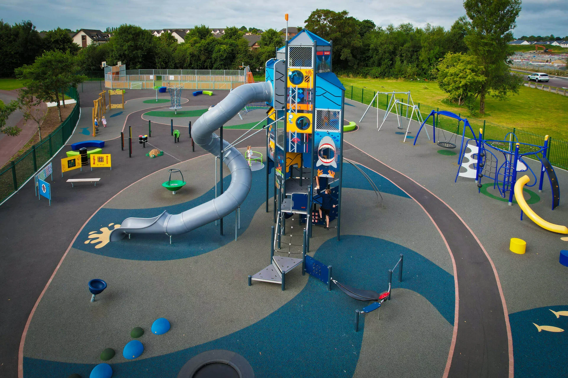 A children's playground with a GIANT playtower with 9 metre slide 