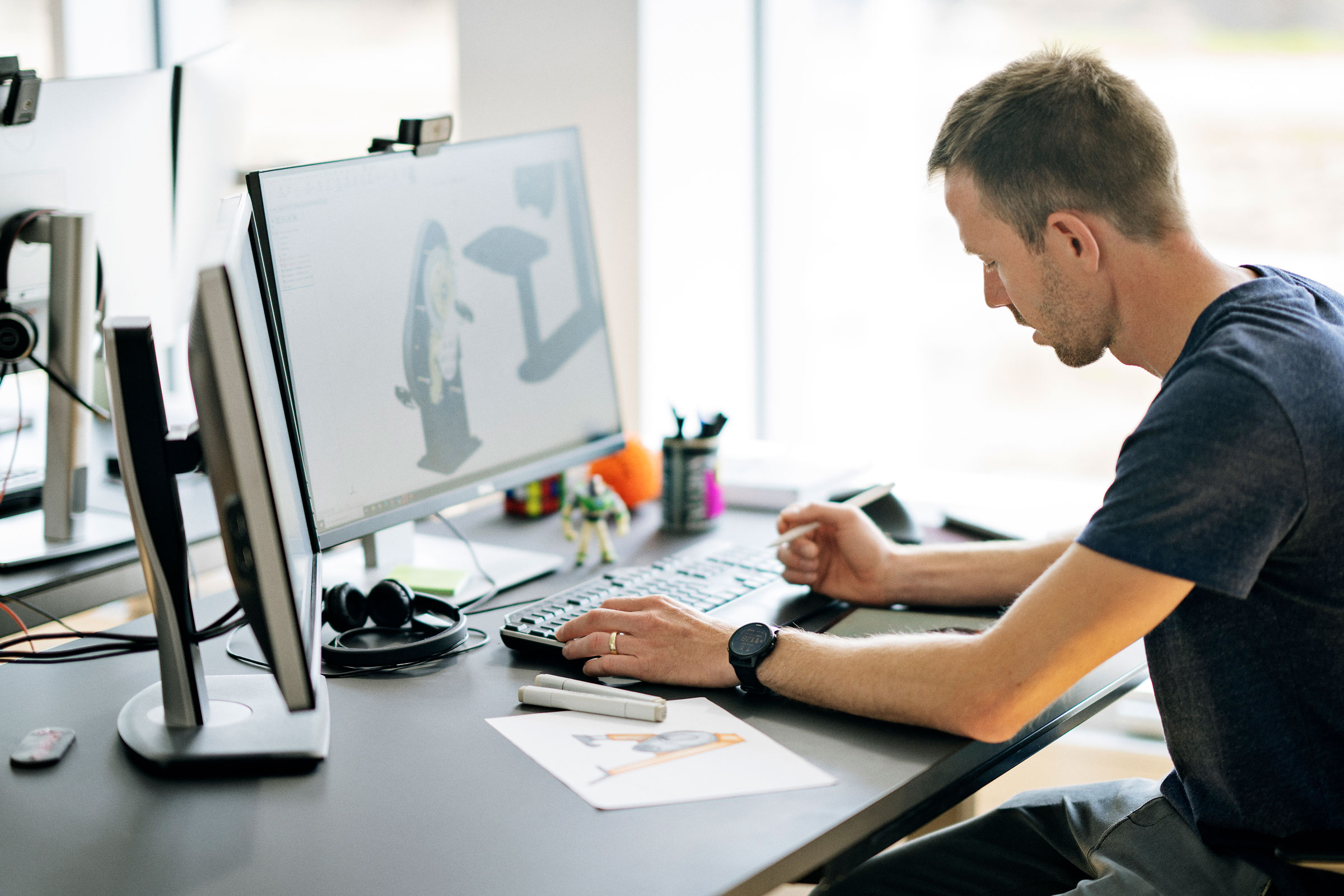 man planning and designing an outdoor fitness product