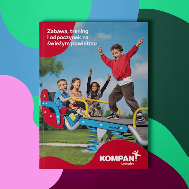 Cover of a Kompan playground catalog showing children playing on a colorful spring rocker in a park under a blue sky
