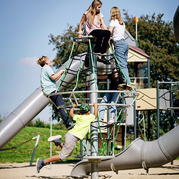 children climbing a corocord dynamics playground reference image