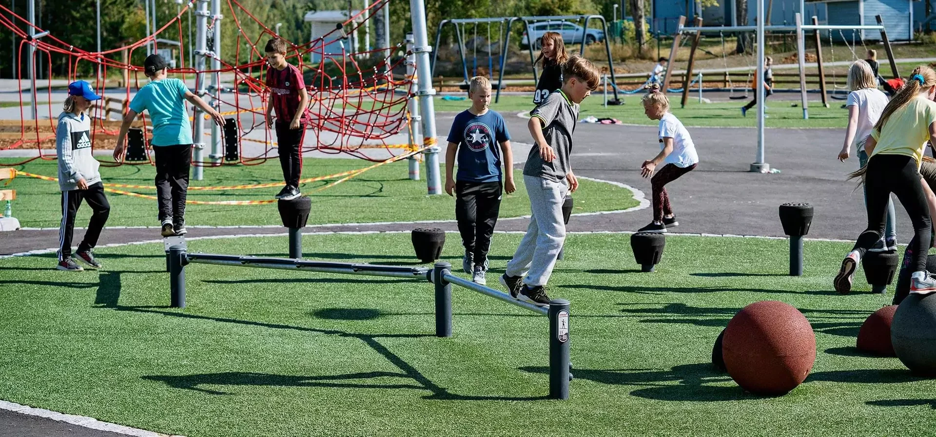 teenagers training on an obstacle course outdoor gym equipment hero image