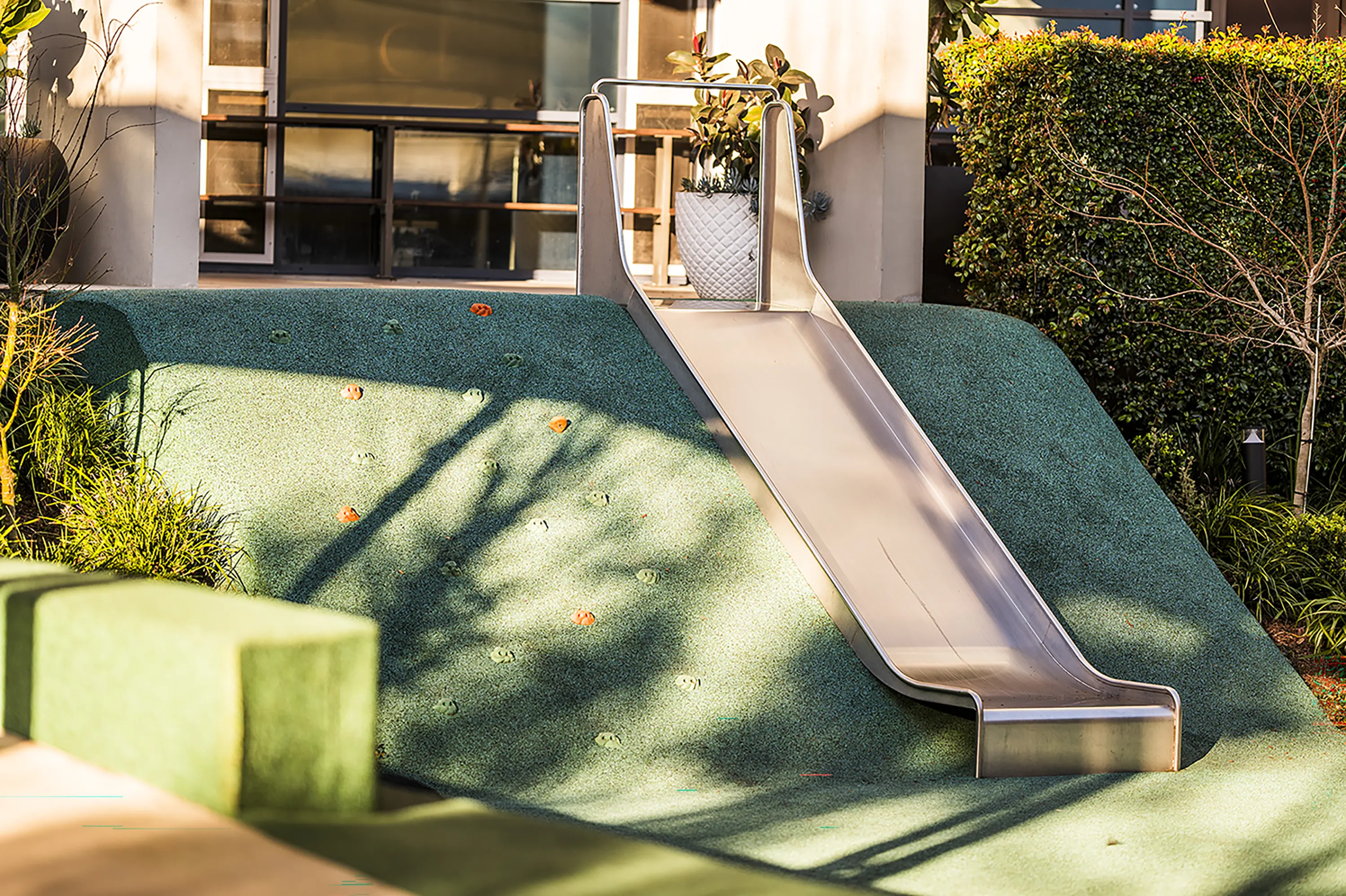 Embankment playground slide, mounted down a mound