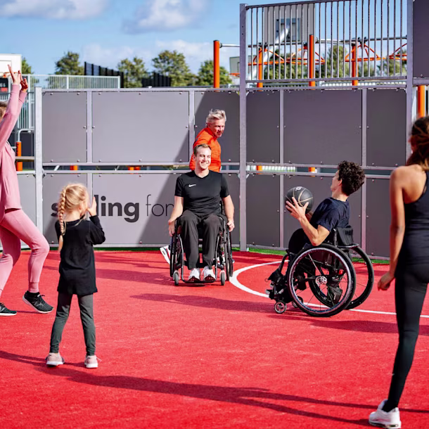 people playing basket on a multi use games area
