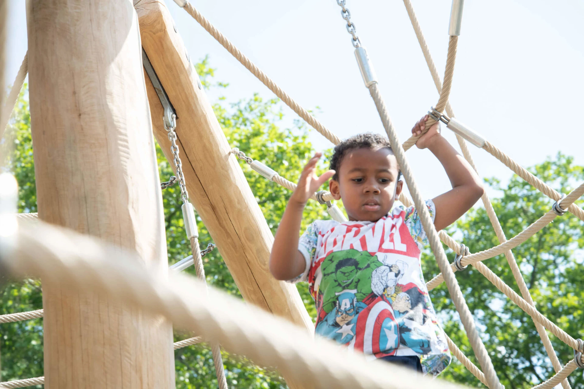 Preschooelrs playing in car themed playground equipment