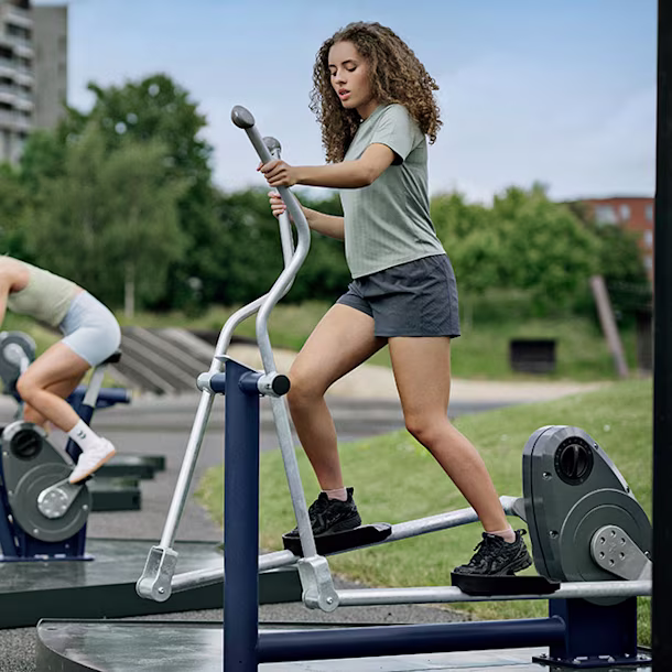 people using outdoor cardio machines top slider image