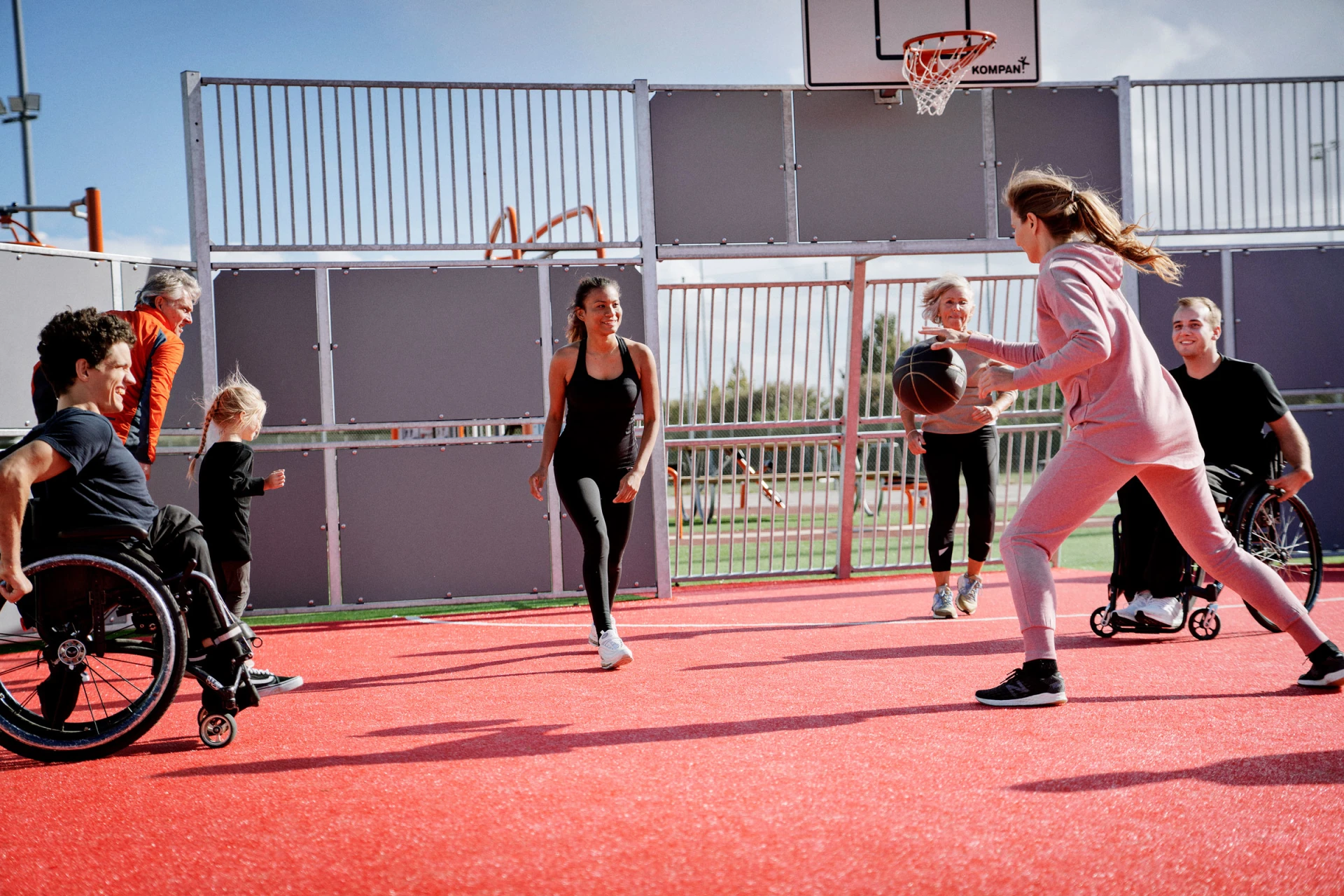 people playing basket on a multi use games area